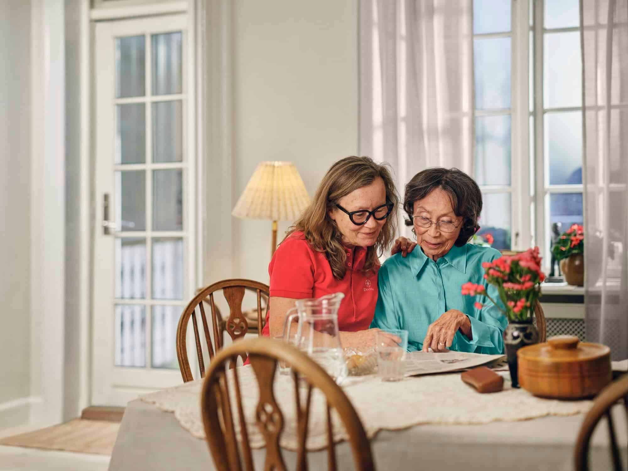 caregiver with client having a meal